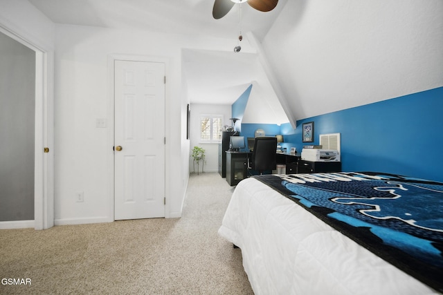 carpeted bedroom featuring visible vents, baseboards, vaulted ceiling, and a ceiling fan