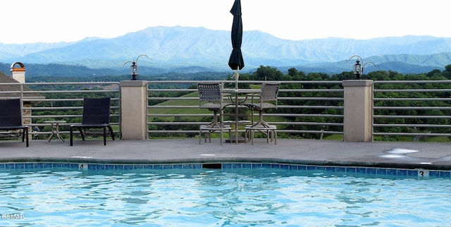 community pool featuring a mountain view