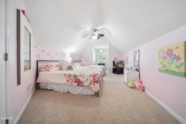 carpeted bedroom with lofted ceiling, ceiling fan, and baseboards