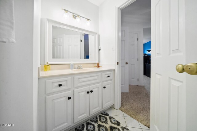 bathroom with tile patterned flooring and vanity