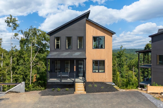 contemporary house featuring a porch