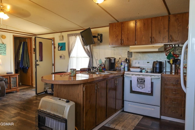 kitchen with white appliances, dark wood-type flooring, a sink, and under cabinet range hood