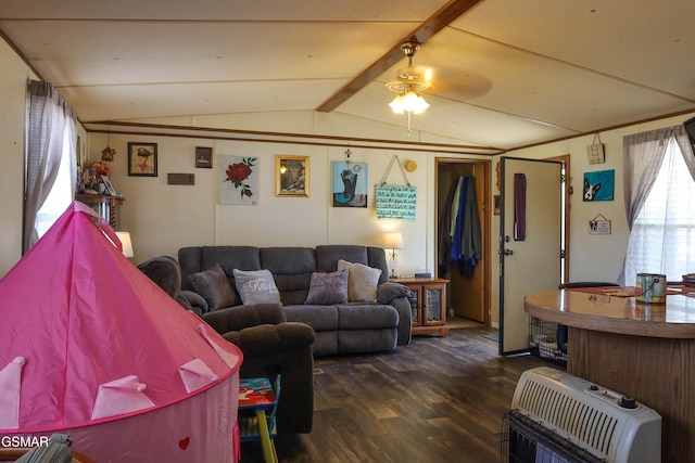 living area with vaulted ceiling with beams, ceiling fan, dark wood-type flooring, and heating unit