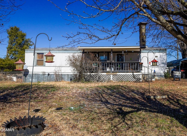 rear view of house with covered porch