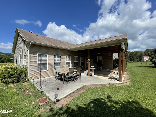 3351 Line Springs Rd, Sevierville, TN 37862 - back of house with a patio area and a lawn