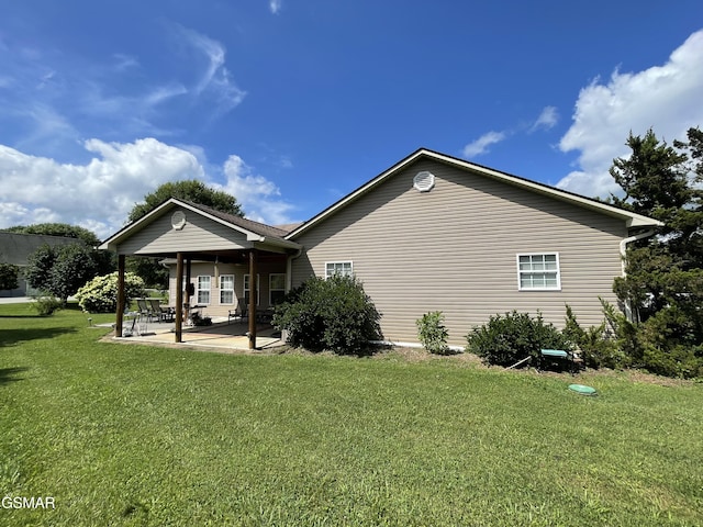 3351 Line Springs Rd, Sevierville, TN 37862 - view of side of property featuring a lawn and a patio