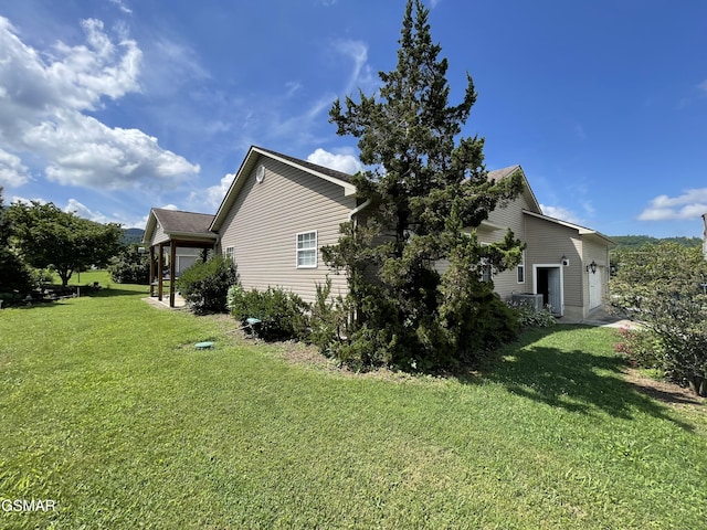 3351 Line Springs Rd, Sevierville, TN 37862 - view of home's exterior with a lawn and an attached garage