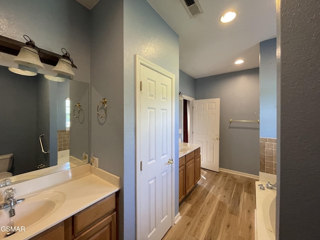 3351 Line Springs Rd, Sevierville, TN 37862 - full bath with vanity, wood finished floors, a bath, and recessed lighting