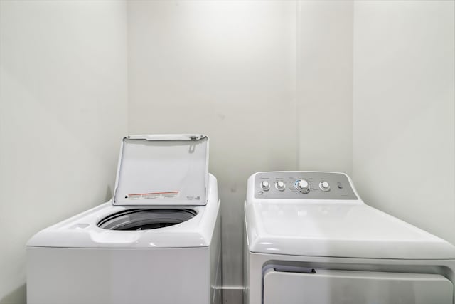laundry room with separate washer and dryer