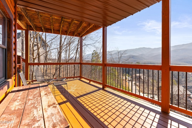 wooden terrace featuring a mountain view