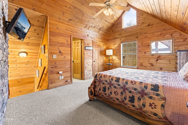 bedroom with wood walls, wood ceiling, vaulted ceiling, carpet flooring, and ceiling fan