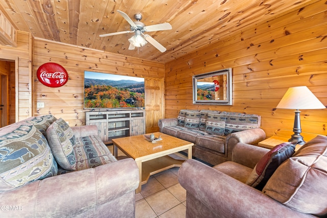 living room featuring light tile patterned floors, wood ceiling, and ceiling fan