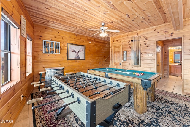 game room with light tile patterned floors, wooden ceiling, wooden walls, and billiards