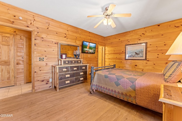 bedroom featuring hardwood / wood-style flooring and ceiling fan