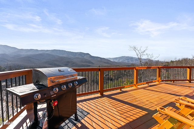 deck featuring a mountain view and grilling area