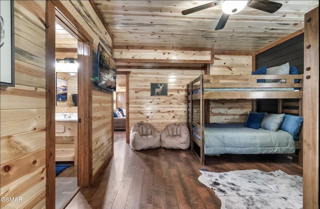 bedroom featuring wood walls, wooden ceiling, and hardwood / wood-style floors