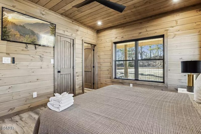 bedroom featuring wood ceiling, wood walls, wood finished floors, and recessed lighting