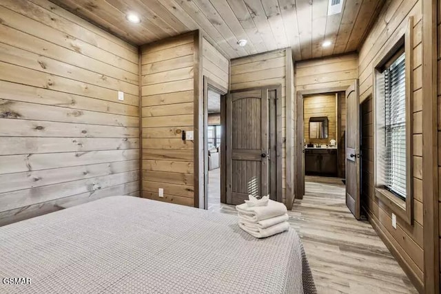 bedroom featuring wood walls, light wood-type flooring, wood ceiling, and recessed lighting