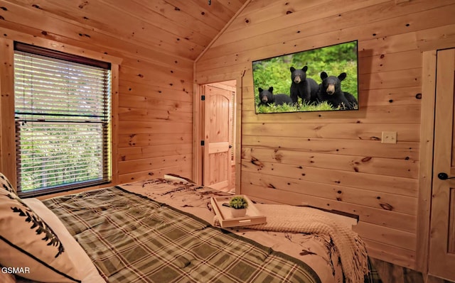 bedroom with vaulted ceiling, wooden ceiling, and wood walls