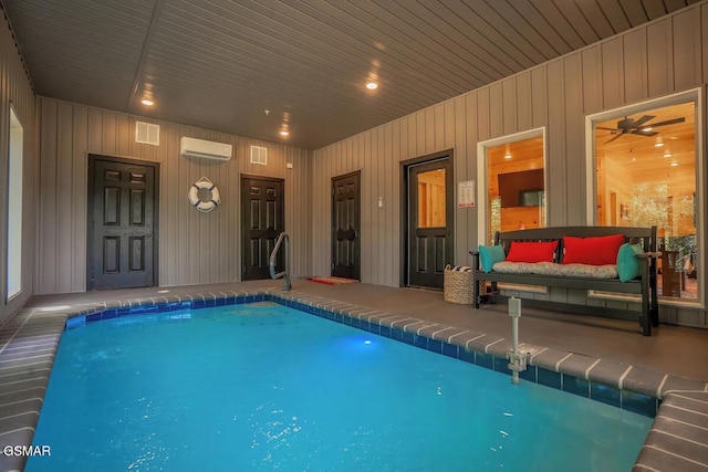 view of swimming pool featuring an AC wall unit