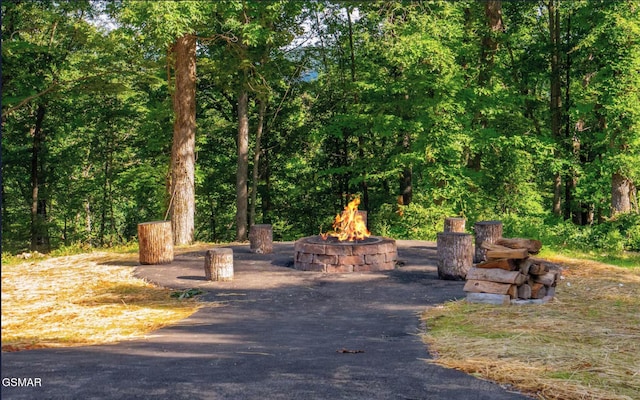 exterior space featuring an outdoor fire pit