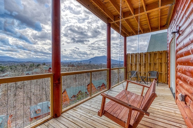 wooden terrace with a mountain view