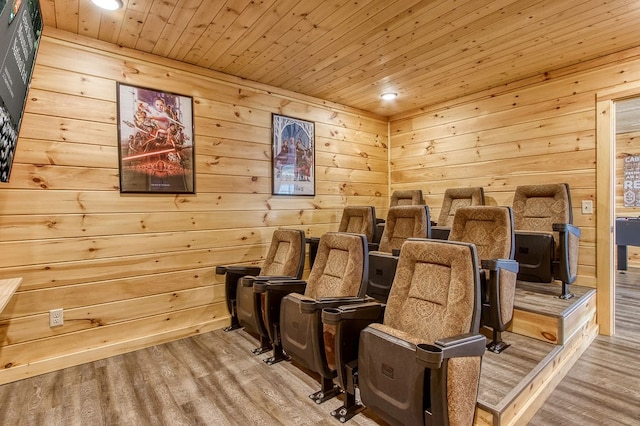 cinema featuring wood walls, hardwood / wood-style floors, and wooden ceiling