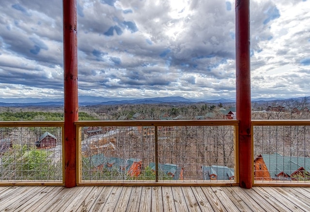 wooden terrace with a mountain view