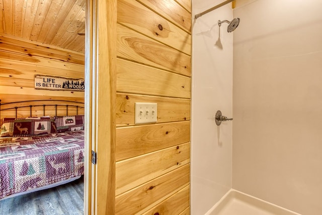 bedroom featuring hardwood / wood-style flooring, wooden walls, and wood ceiling