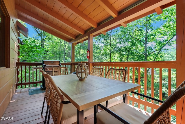 wooden deck featuring area for grilling