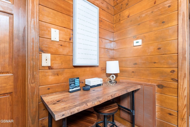 home office featuring wooden walls