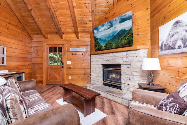 living room featuring hardwood / wood-style flooring, lofted ceiling with beams, wooden ceiling, and wooden walls