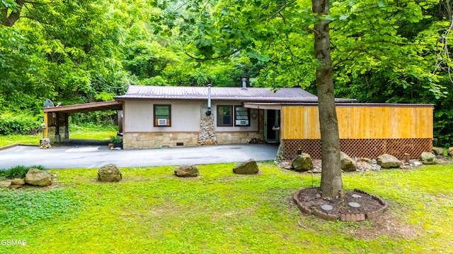 1069 Bryan Rd, Sevierville, TN 37862 - view of front of property featuring stone siding, metal roof, a front yard, and driveway