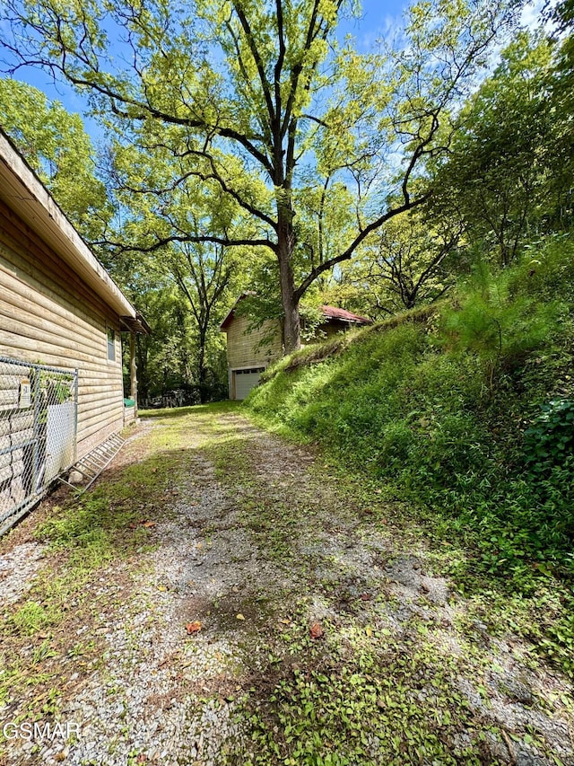 4205 Birds Creek Rd, Sevierville, TN 37876 - view of yard featuring driveway and a garage
