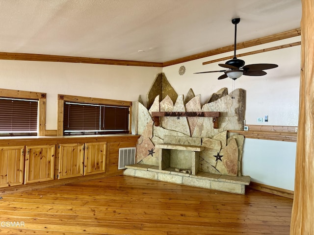 4205 Birds Creek Rd, Sevierville, TN 37876 - unfurnished living room with crown molding, light wood-style flooring, a ceiling fan, and visible vents