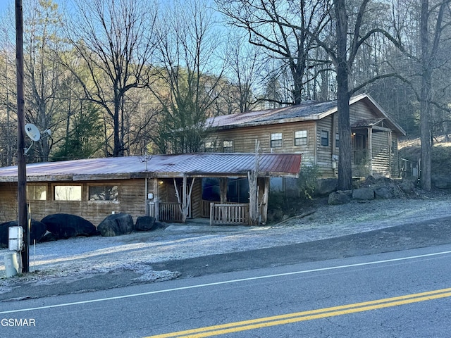 4205 Birds Creek Rd, Sevierville, TN 37876 - view of front of home featuring metal roof and covered porch
