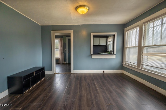 spare room featuring dark hardwood / wood-style flooring