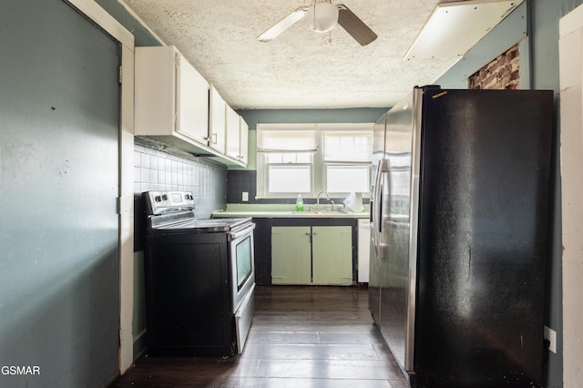 kitchen featuring sink, white cabinetry, tasteful backsplash, appliances with stainless steel finishes, and dark hardwood / wood-style flooring