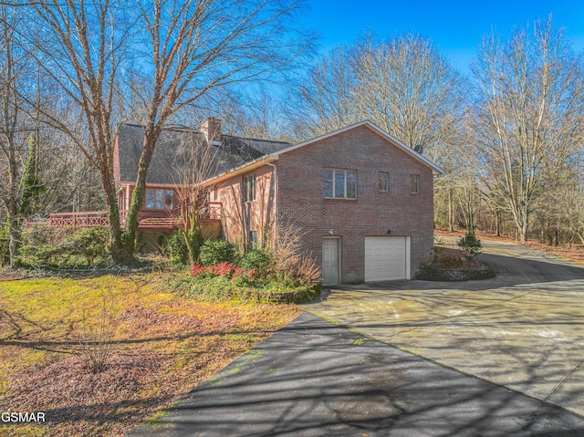 view of side of property with a garage