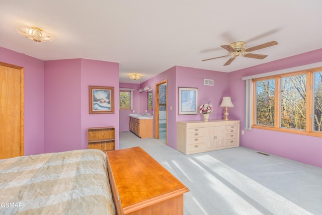 bedroom featuring light carpet