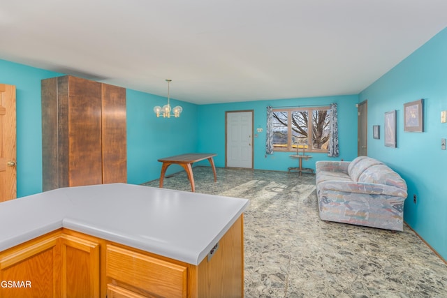 kitchen featuring decorative light fixtures and a chandelier