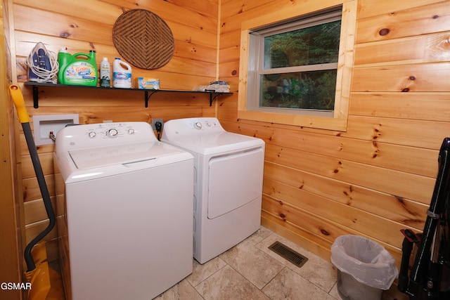933 E Foothills Dr, Gatlinburg, TN 37738 - laundry area with washer and clothes dryer and wooden walls