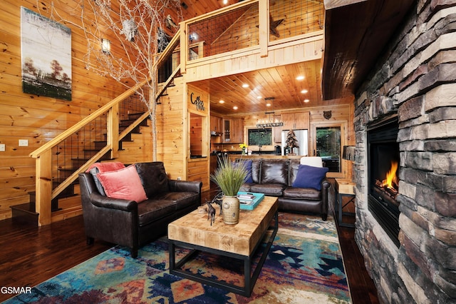 933 E Foothills Dr, Gatlinburg, TN 37738 - living area with wooden walls, wood-type flooring, stairs, a fireplace, and recessed lighting