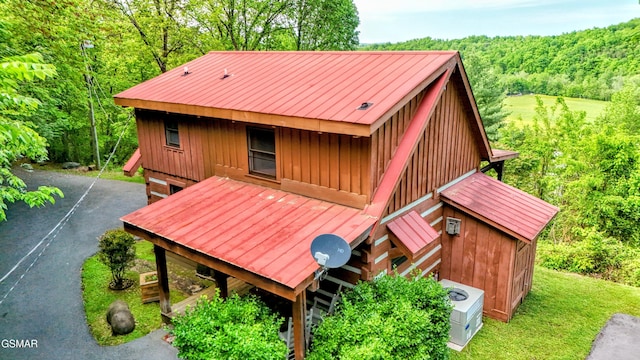 exterior space with a wooded view