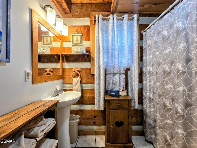 bathroom with tile patterned floors and a shower with curtain