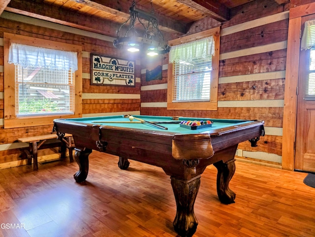 rec room featuring beamed ceiling, pool table, and wood walls