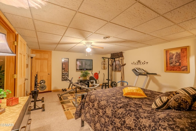 carpeted bedroom featuring a paneled ceiling and ceiling fan