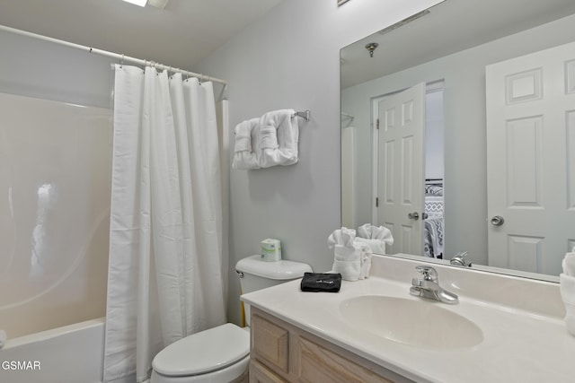 bathroom featuring toilet, shower / bathtub combination with curtain, and vanity