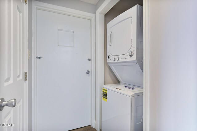 laundry area featuring laundry area and stacked washer / drying machine