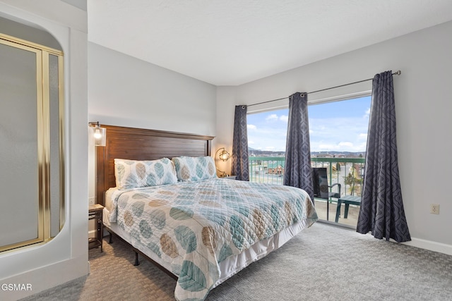 bedroom with baseboards, carpet floors, and access to exterior